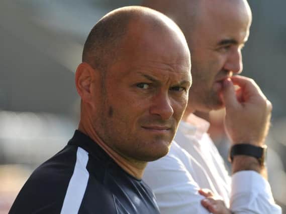 PNE manager Alex Neil with Joe Savage to his left