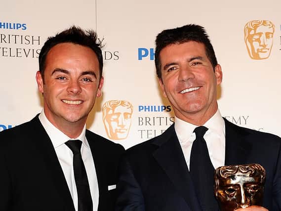 Anthony McPartlin (left) and Simon Cowell who has backed the presenter to make a full recovery