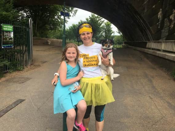 Phoebe Bolton with her mum Sharron at the start of the Guild Wheel walk for Cystic Fibrosis Trust