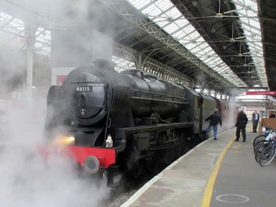 The Scots Guardsman steam train, built in 1927, waits on the platform at Preston station