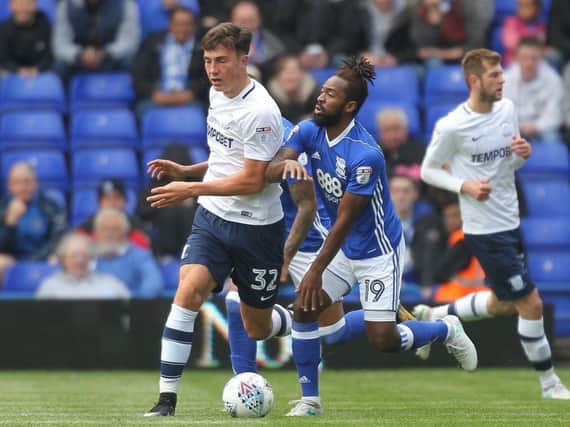 Josh Earl challenges Birmingham's Jacques Maghoma