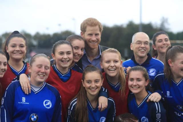 All smiles: The Prince poses for team pictures