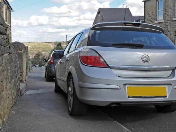 Cars parked on pavements can be a hazard for blind people