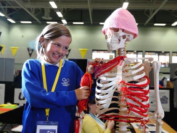 Amy Helsby with a model skeleton at last year's festival.