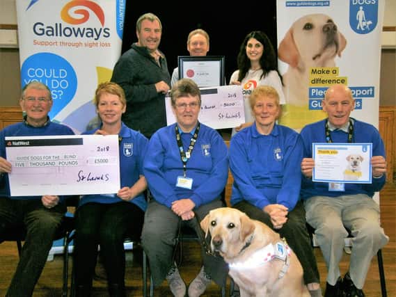 Members of St Gerards Club in Lostock Hall raised 5,000 for The Guide Dogs Association and Galloway's Society for the Blind. They were also given the highest honour plaque for raising a large amount for the NSPCC