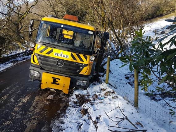 The gritter was pictured stranded in a ditch PIC: Jon Fishwick.