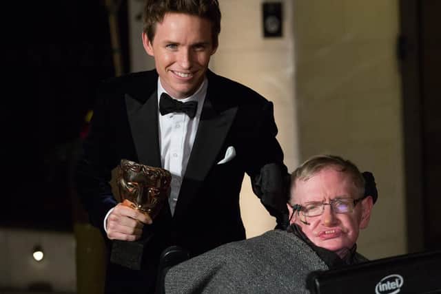 Eddie Redmayne and Professor Stephen Hawking, who has died aged 76, arriving at the After-party dinner for the EE British Academy Film Awards at Grosvenor House Hotel in London.