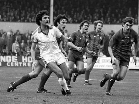 PNE right-back John McMahon - with Mike Elwiss behind him - passes the ball against Crystal Palace in 1978
