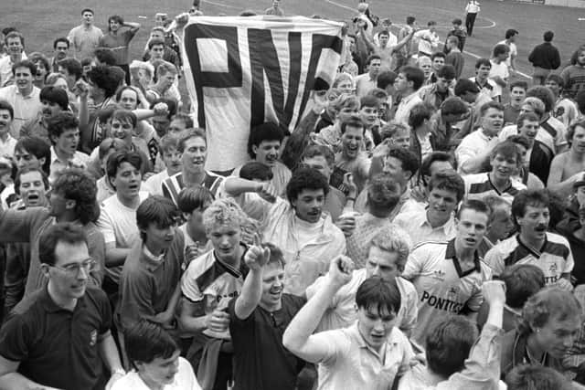 Preston fans on the pitch at Brisbane Road after PNE's promotion