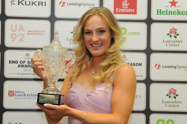 Emma Lamb celebrates with her award