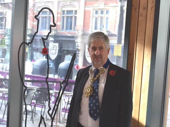 Preston mayor Trevor Hart with the Tommy figure at Preston Market