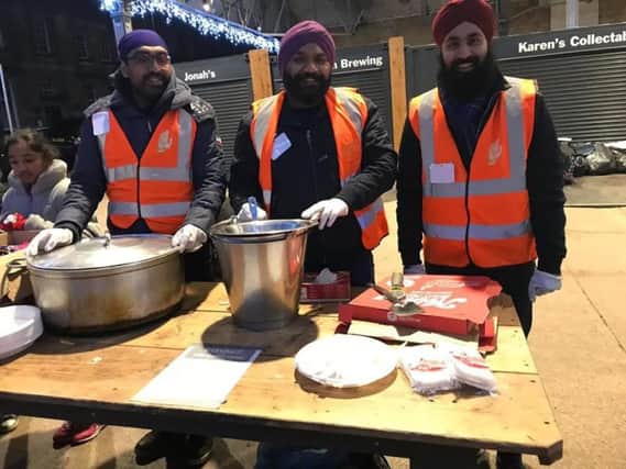 Members of Preston Sikh Seva Society UK servedhot vegetarian food