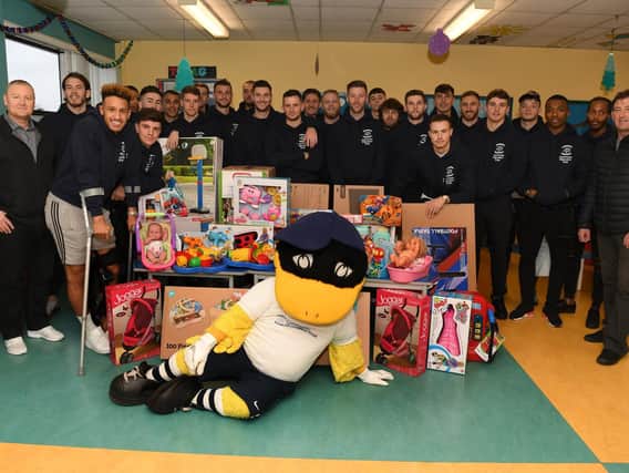 Preston North End's players with the Deepdale Duck at Royal Preston Hospital on Tuesday