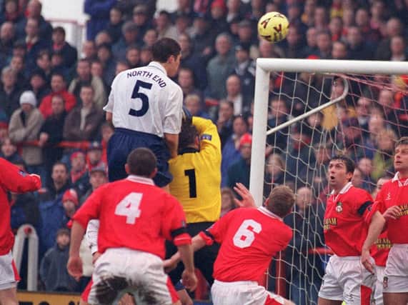 Michael Jackson heads Preston in front against Wrexham at the Racecourse Ground in January 1999