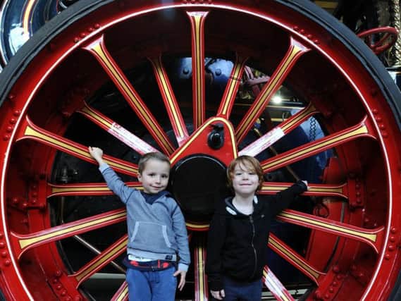 Aaron Dorset aged 5 and Torrin Baker aged 4 in the giant wheels of a steam engine. Picture by Paul Heyes.