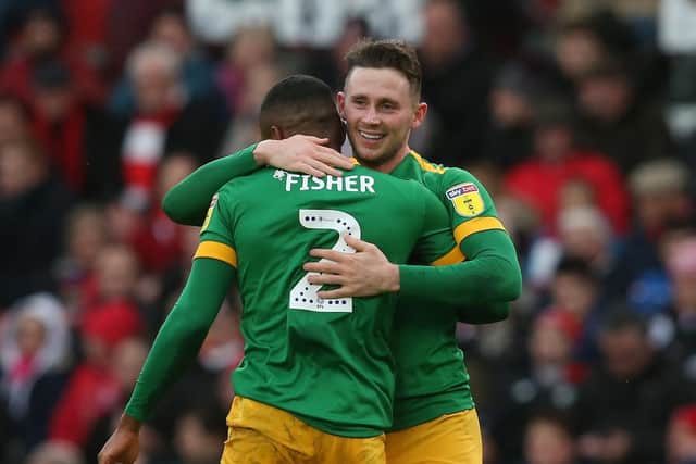 Darnell Fisher and Alan Browne celebrate Preston's opening goal at Stoke