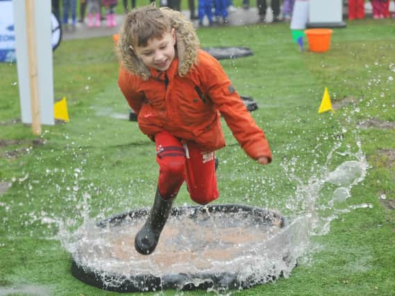 Having a splashing time - children will love to join in the Puddle Jumping Championships at WWT Martin Mere