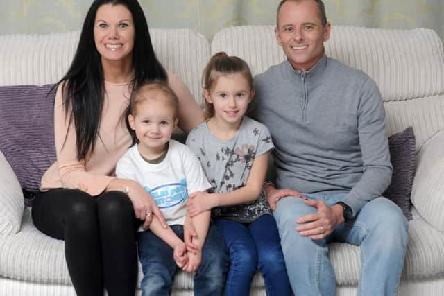 Mitchie Brown at home with sister Zoe, 6, and parents Tara and Tony