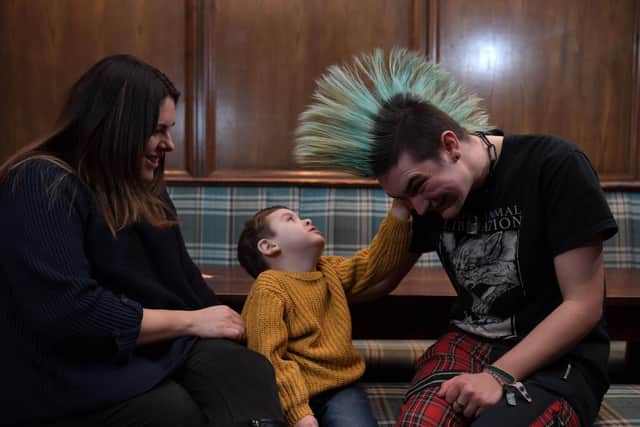 Barman Damian Murray agreed to shave off his mohican to raise money for William Ballantyne, four