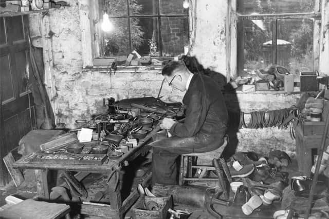 Clog maker Harold Rogan is pictured at work making clogs in his workshop in Churchgate, Lancashire