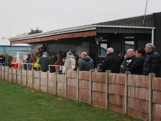 AFC Blackpool fans watch the on-the-field action at the club's Jepson Way ground.
