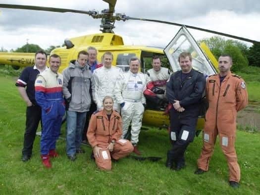 Tim Foster, motorcyclist Jim Moodie, Kris Meeke, Gordon Birtwistle (director of Proflex UK), Alister McRae, Jimmy McRae, Colin McRae and a crew from the North West Air Ambulance. (s)