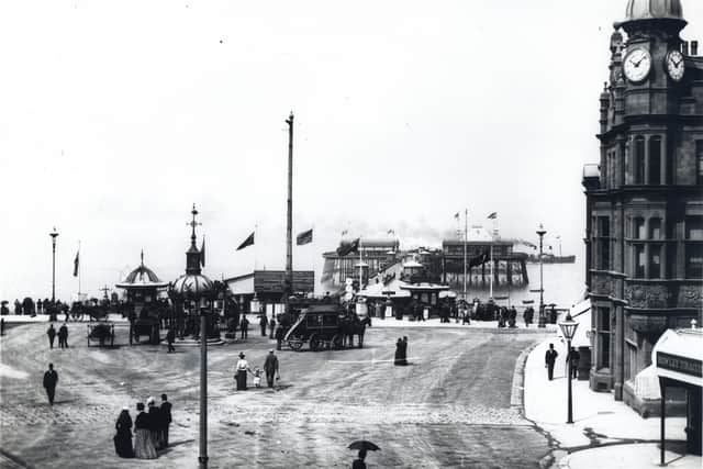 Smoke across the sea as a pleasure steamer leaves the North Pier, in Blackpool, in the late 1800s