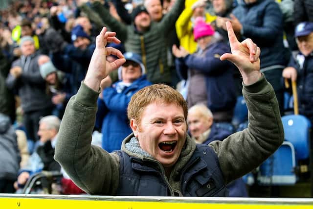 A Preston fan reminds the Blackburn supporters of the score