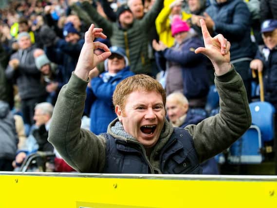 A Preston fan reminds the Blackburn supporters of the score