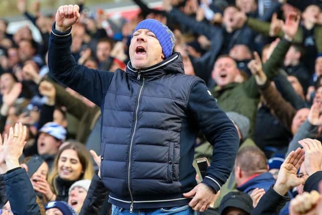 A PNE fan celebrates at the final whistle