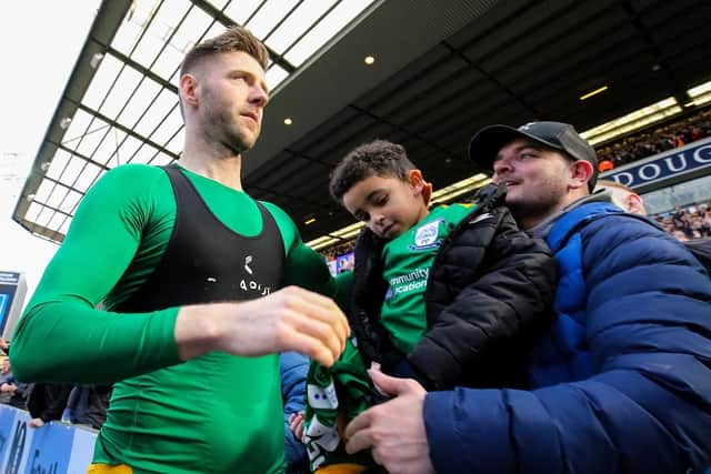 Paul Gallagher gives his shirt to a young fan at the final whistle