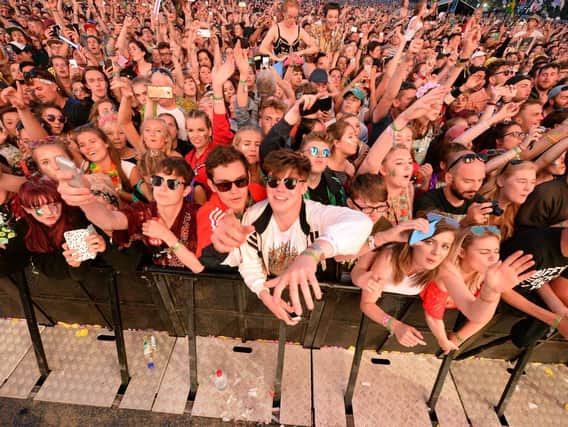 Festivalgoers at the Pyramid Stage at Glastonbury Festival, Worthy Farm in Somerset. The Killers and The Cure have joined Glastonbury Festival's line-up of headliners - while Janet Jackson is also on the bill.