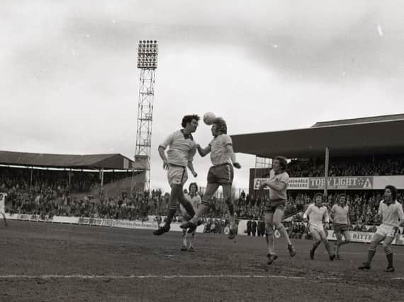 Preston striker Mel Holden challenges in the air against Hereford at Deepdale in April 1975