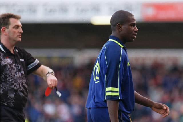 Preston striker Jason Harris is shown the red card by referee Trevor Jones
