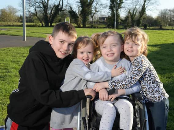 Caidi Gregson, 4, has cerebal palsy and hopes to raise 16,000 for an operation, pictured with Cian, Connie-Jayne and cousin Kylie