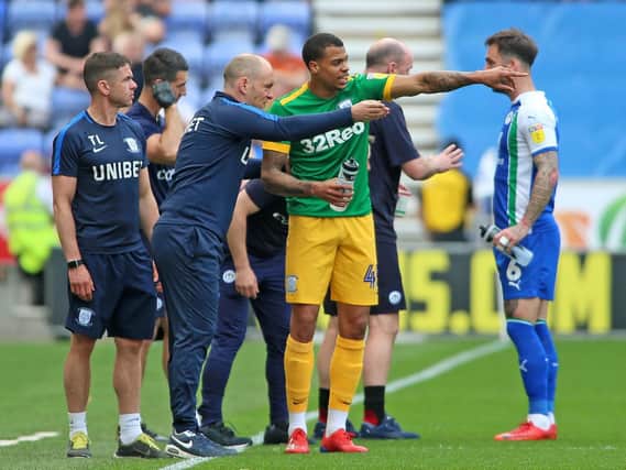 Preston boss Alex Neil gives instructions to Lukas Nmecha during the defeat at Wigan
