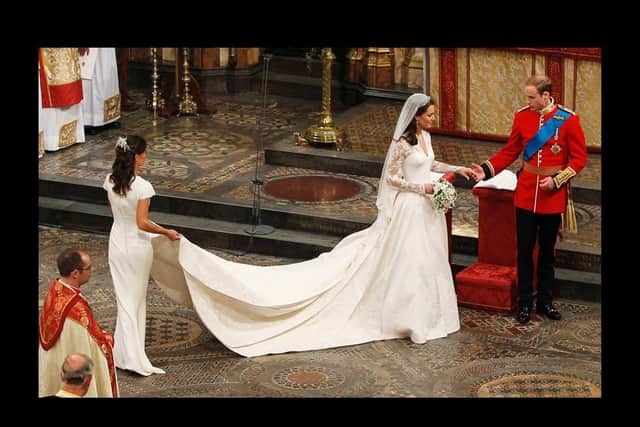 Britain's Prince William (R) and his wife Kate, Duchess of Cambridge, accompanied by her maid of honour Pippa Middleton