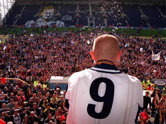 PNE striker Andy Saville looks out from the Pavilion Stand on to the Deepdale pitch after victory over Exeter City in May 1996