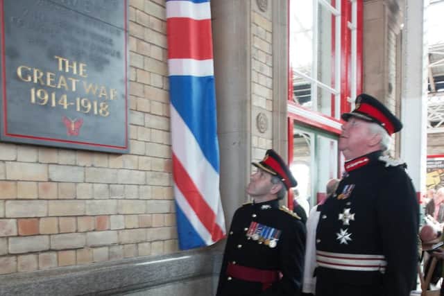 Lord Shuttleworth, Lord Lieutenant of Lancashire (right), accompanied by Colonel Steve Davies of the Duke of Lancasters Regiment, unveils the plaque in 2012