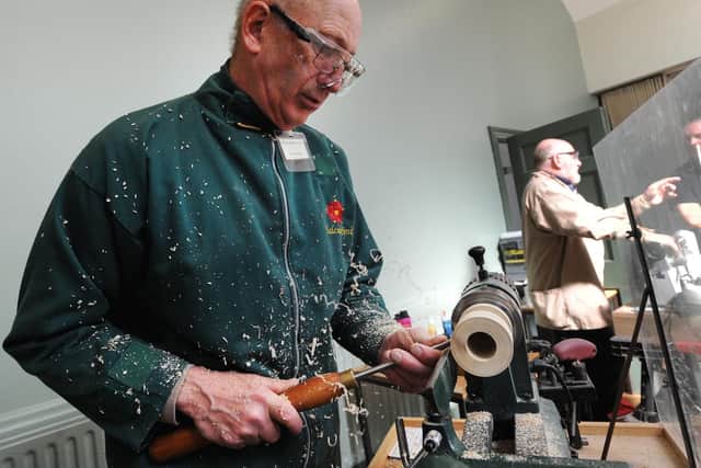 Malcolm Smith from Lancaster carves a spice pot on his lathe.