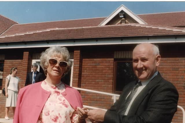 Builder Bert Ainscough hands over the keys of Derian House to Margaret Vinten, chairman of the trustees, in 1993