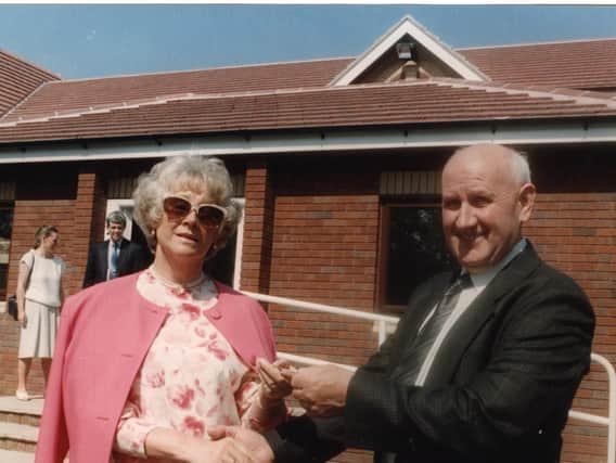 Builder Bert Ainscough hands over the keys of Derian House to Margaret Vinten, chairman of the trustees, in 1993