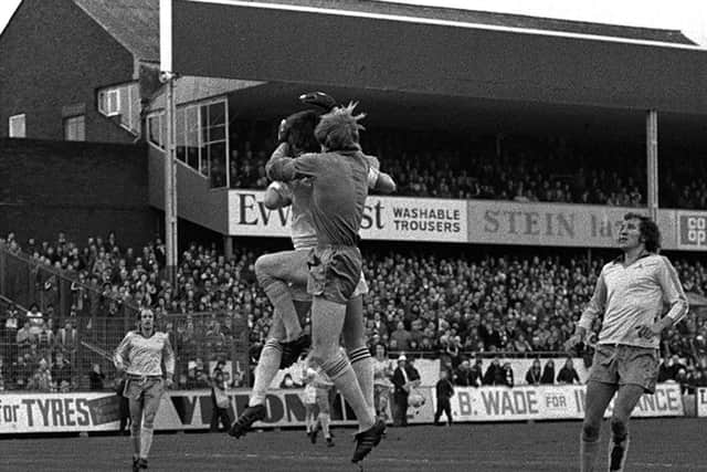 PNE striker Mick Robinson challenges Notts County goalkeeper Eric McManus