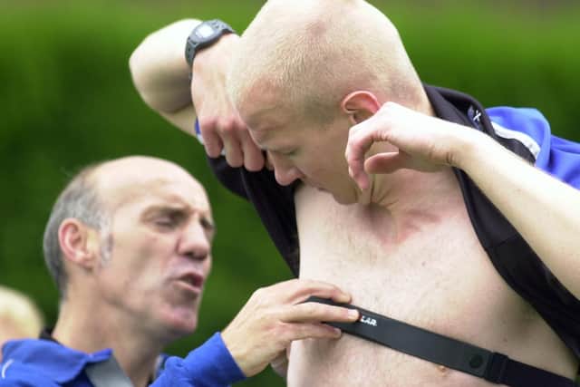 PNE physio Mick Rathbone attaches a heart monitor to goalkeeper Tepi Moilanen