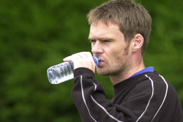 Graham Alexander takes a drink in 2001