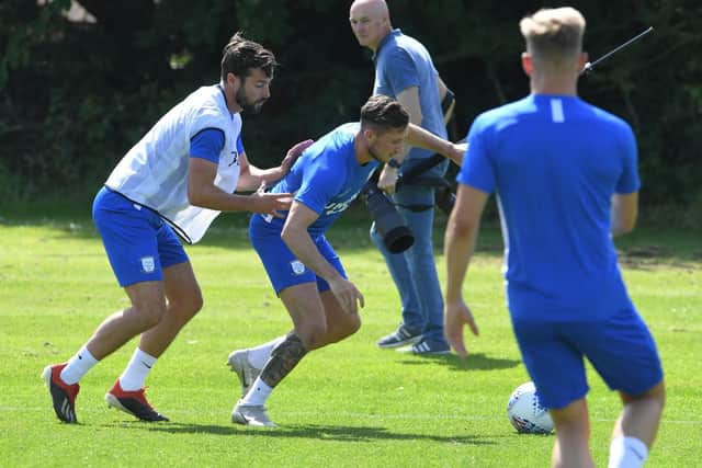 Alan Browne attempts to hold off Joe Rafferty in a training drill