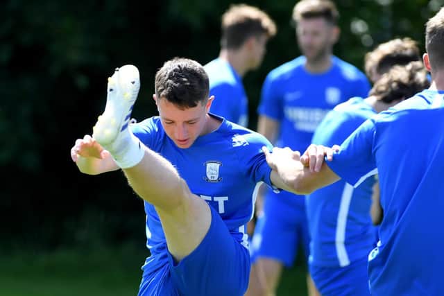 PNE midfielder Jack Baxter stretches in the warm-up.