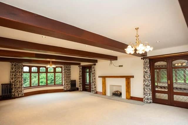 The lounge, with its own bay window, leads through to the orangery.