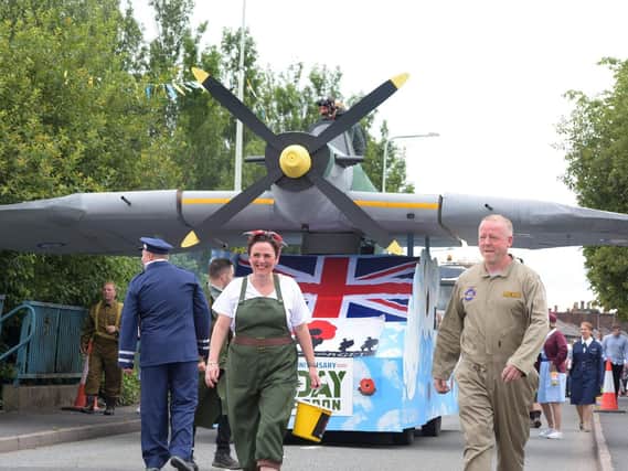 The Gala Group's Spitfire trundles through Adlington as part of the carnival