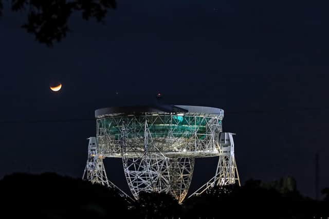 Partial lunar eclipse lights up skies 50 years on from Apollo 11 launch